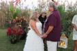 Kim & Larry Testerman exchanged vows in a beautiful bayside backyard ceremony with officiant Billie Carlins. photo courtesy of Denny Dinsmore